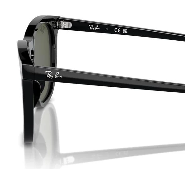 Ray-Ban RB2210 Sunglasses in black featuring polarized lenses and a logo on the side, showcased on a white reflective surface.