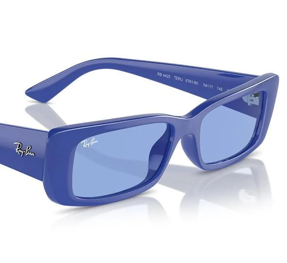 The Ray-Ban TERU RB4425 blue rectangular sunglasses, featuring light blue bio-nylon lenses, are shown from an angled side view, exuding a retro vibe.